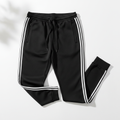 Black streetwear joggers with side stripes